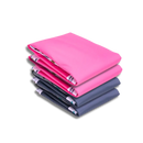 Conjunto com 2 tapetes rosa e 2 azuis laváveis, empilhados